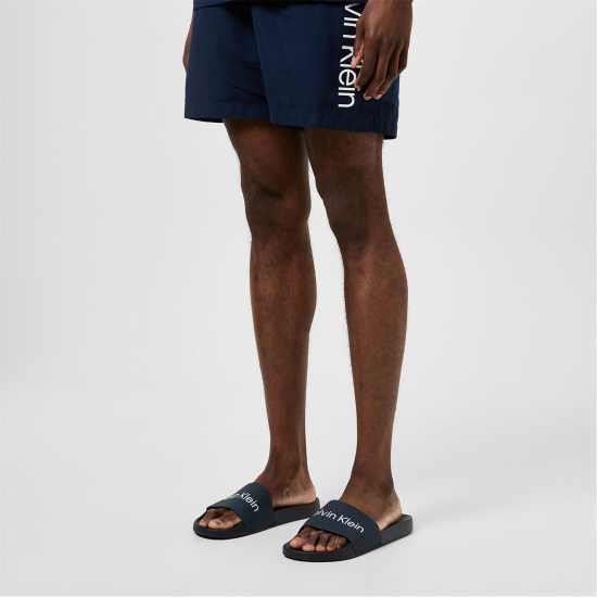 Мъжки сандали и джапанки Calvin Klein Logo Sliders Морско синьо/Бяло Calvin Klein Logo Sliders Морско синьо/Бяло Мъжки сандали и джапанки