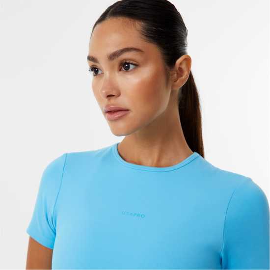 Дамски дрехи за бягане Usa Pro X Sophie Habboo Short Sleeve Crop Tee Аква Usa Pro X Sophie Habboo Short Sleeve Crop Tee Аква Дамски дрехи за бягане