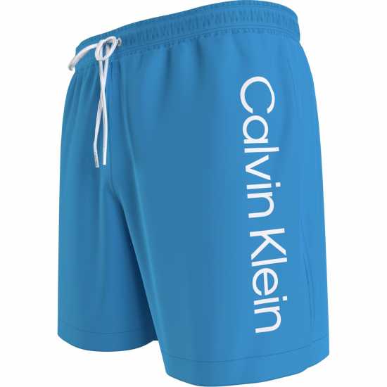 Мъжки плувни шорти и клинове Calvin Klein Large Logo Swim Shorts Син 2025 Calvin Klein Large Logo Swim Shorts Син 2025 Мъжки плувни шорти и клинове
