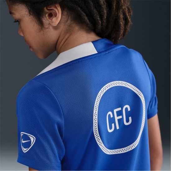Футболни тренировъчни горнища Nike Chelsea Strike Top 2025 2026 Juniors Nike Chelsea Strike Top 2025 2026 Juniors Футболни тренировъчни горнища