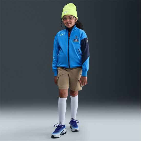 Футболни тренировъчни якета Nike Tottenham Hotspur Anthem Jacket 2025 2026 Juniors Nike Tottenham Hotspur Anthem Jacket 2025 2026 Juniors Футболни тренировъчни якета