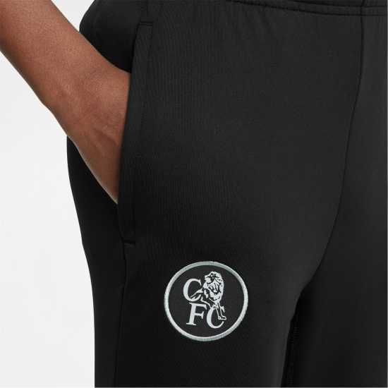 Детски долнища за бягане Nike Chelsea Strike Tracksuit Bottoms 2025 2026 Juniors Nike Chelsea Strike Tracksuit Bottoms 2025 2026 Juniors Детски долнища за бягане