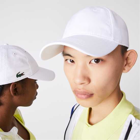 Шапки с козирка Lacoste Baseball Cap Бяло 001 Lacoste Baseball Cap Бяло 001 Шапки с козирка