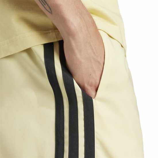 Adidas Essentials 3-Stripes Shorts Прахово жълто Дамски къси панталони