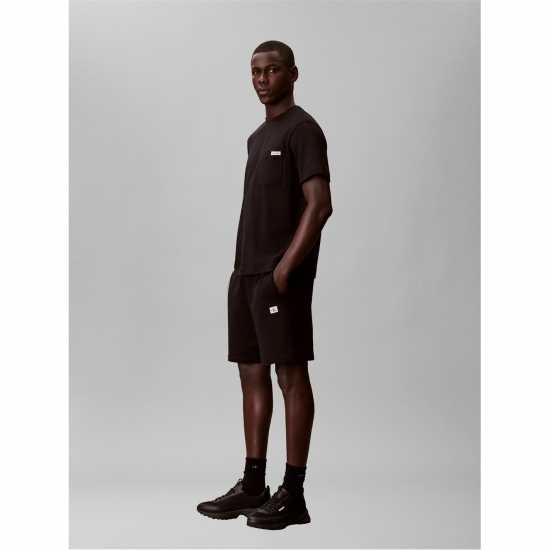 Calvin Klein Jeans Men's Woven Badge Fleece Jogger Shorts  
