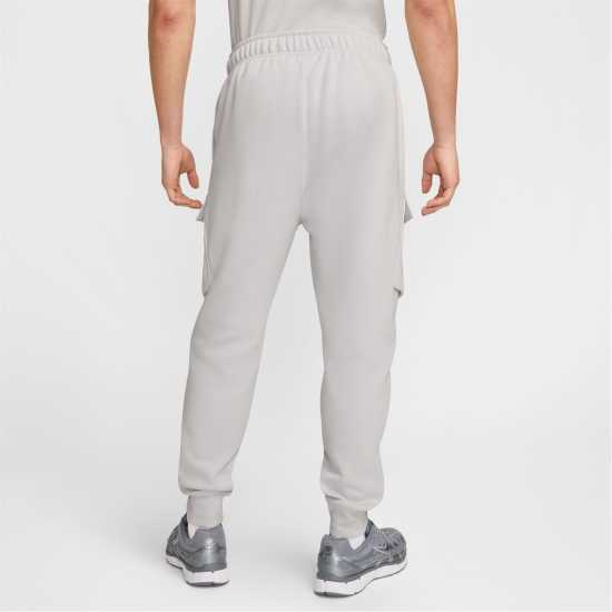 Мъжки меки спортни долнища Nike Nsw Sw Air Cargo Pant Flc Bb Сиво/Бяло Nike Nsw Sw Air Cargo Pant Flc Bb Сиво/Бяло Мъжки меки спортни долнища