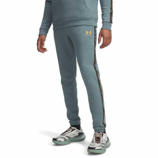 Under Armour Мъжко Спортно Долнище Icon Fleece Taping Joggers Mens Jasper Blue Мъжки меки спортни долнища