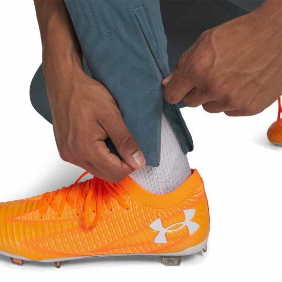 Мъжки спортни екипи в две части Under Armour Chal Pro Pant Sn61 Grey/Orange Under Armour Chal Pro Pant Sn61 Grey/Orange Мъжки спортни екипи в две части