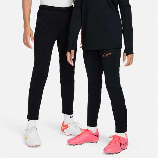 Детски долнища за бягане Nike Academy Training Pants Juniors Black/White/Pink Nike Academy Training Pants Juniors Black/White/Pink Детски долнища за бягане