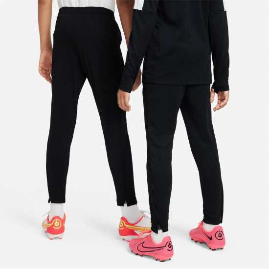 Детски долнища за бягане Nike Academy Training Pants Juniors Black/White/Pink Nike Academy Training Pants Juniors Black/White/Pink Детски долнища за бягане