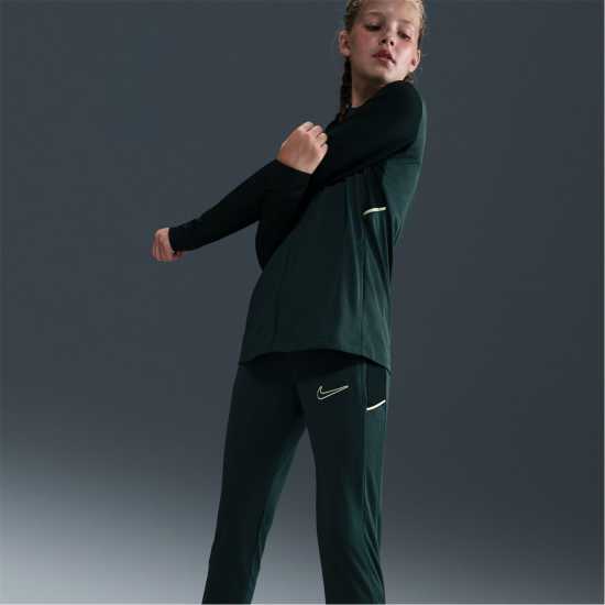 Детски долнища за бягане Nike Academy Training Pants Juniors Black/White/Pink Nike Academy Training Pants Juniors Black/White/Pink Детски долнища за бягане