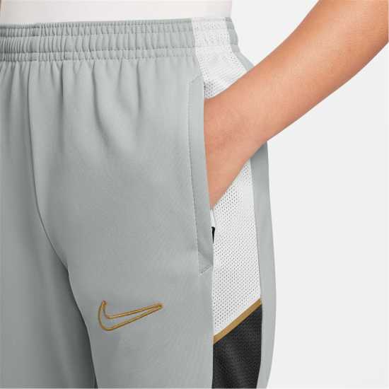 Nike Детски Анцуг Academy Training Tracksuit Bottoms Juniors Grey/Gold Nike Детски Анцуг Academy Training Tracksuit Bottoms Juniors Grey/Gold