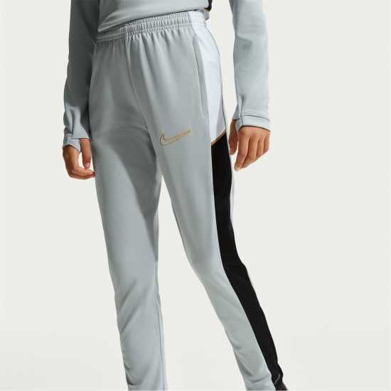 Nike Детски Анцуг Academy Training Tracksuit Bottoms Juniors Grey/Gold Nike Детски Анцуг Academy Training Tracksuit Bottoms Juniors Grey/Gold