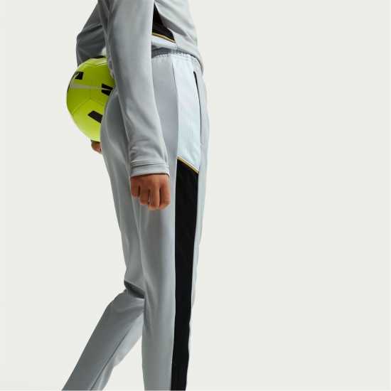 Nike Детски Анцуг Academy Training Tracksuit Bottoms Juniors Grey/Gold Nike Детски Анцуг Academy Training Tracksuit Bottoms Juniors Grey/Gold