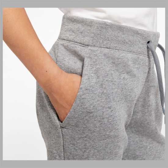 Детски долнища на анцуг Nike Girls Fundamentals Fleece Jogging Bottoms Сиво/Бяло Nike Girls Fundamentals Fleece Jogging Bottoms Сиво/Бяло Детски долнища на анцуг