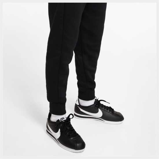 Детски долнища на анцуг Nike Girls Fundamentals Fleece Jogging Bottoms Черно/Бяло Nike Girls Fundamentals Fleece Jogging Bottoms Черно/Бяло Детски долнища на анцуг