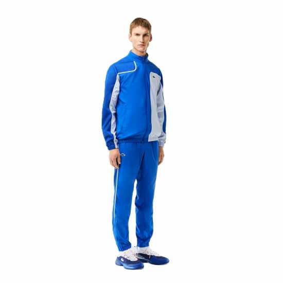 Мъжки спортни екипи в две части Lacoste Logo Stripe Tracksuit Морско синьо/бяло Lacoste Logo Stripe Tracksuit Морско синьо/бяло Мъжки спортни екипи в две части