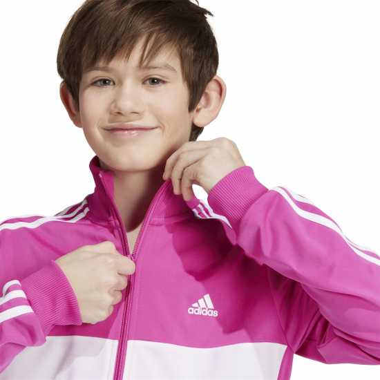 Детски спортни екипи Adidas Essentials Tiberio Tracksuit Полу люцидна Фуч Adidas Essentials Tiberio Tracksuit Полу люцидна Фуч Детски спортни екипи