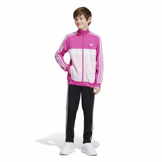 Детски спортни екипи Adidas Essentials Tiberio Tracksuit Полу люцидна Фуч Adidas Essentials Tiberio Tracksuit Полу люцидна Фуч Детски спортни екипи