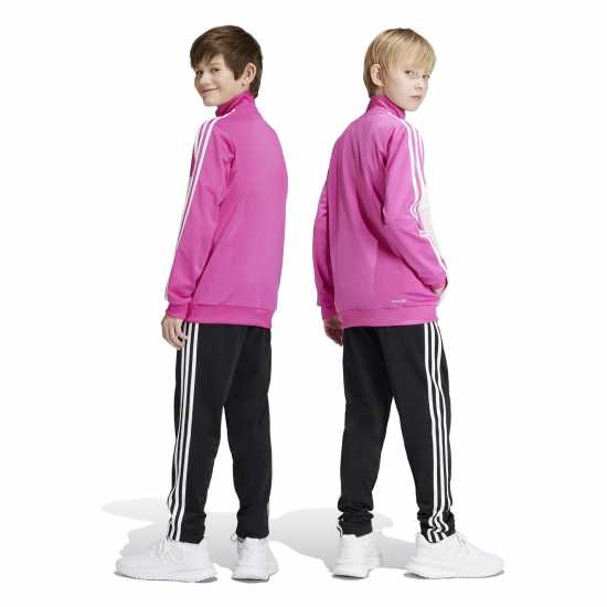 Детски спортни екипи Adidas Essentials Tiberio Tracksuit Полу люцидна Фуч Adidas Essentials Tiberio Tracksuit Полу люцидна Фуч Детски спортни екипи