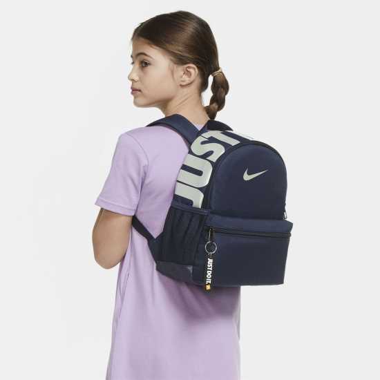 Ученически раници Nike Основна Раница Mini Base Backpack Navy/Iridescent Nike Основна Раница Mini Base Backpack Navy/Iridescent Ученически раници