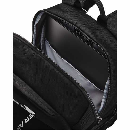 Ученически раници Under Armour Armour Ua Hustle Lite Backpack Черен Металик Сил Under Armour Armour Ua Hustle Lite Backpack Черен Металик Сил Ученически раници