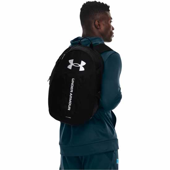Ученически раници Under Armour Armour Ua Hustle Lite Backpack Черен Металик Сил Under Armour Armour Ua Hustle Lite Backpack Черен Металик Сил Ученически раници