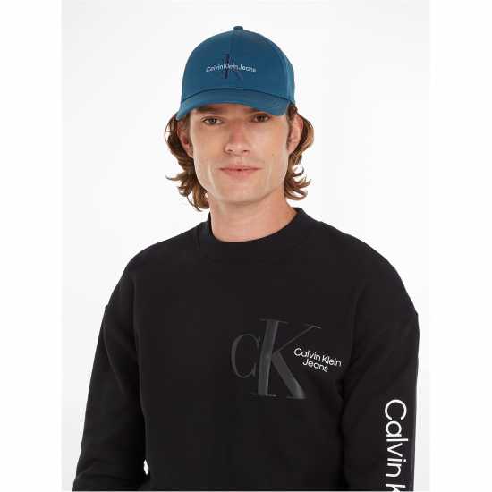 Шапки с козирка Calvin Klein Jeans Monogram Embroidered Cap Син CGX Calvin Klein Jeans Monogram Embroidered Cap Син CGX Шапки с козирка